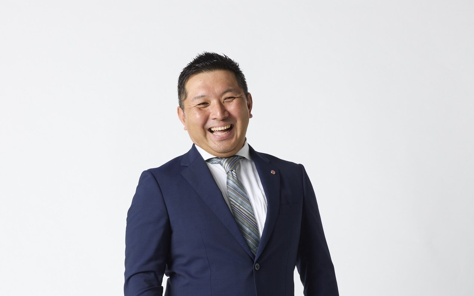 笑顔の株式会社丸鉦の後藤 昌彦社長